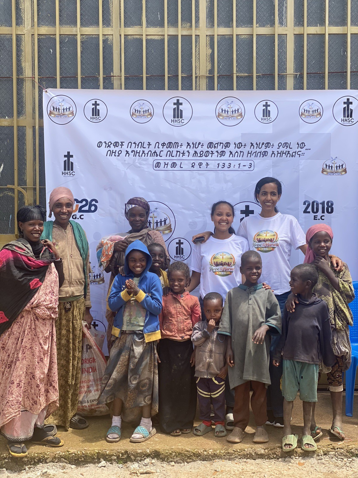 Mothers and children receiving care from volunteers