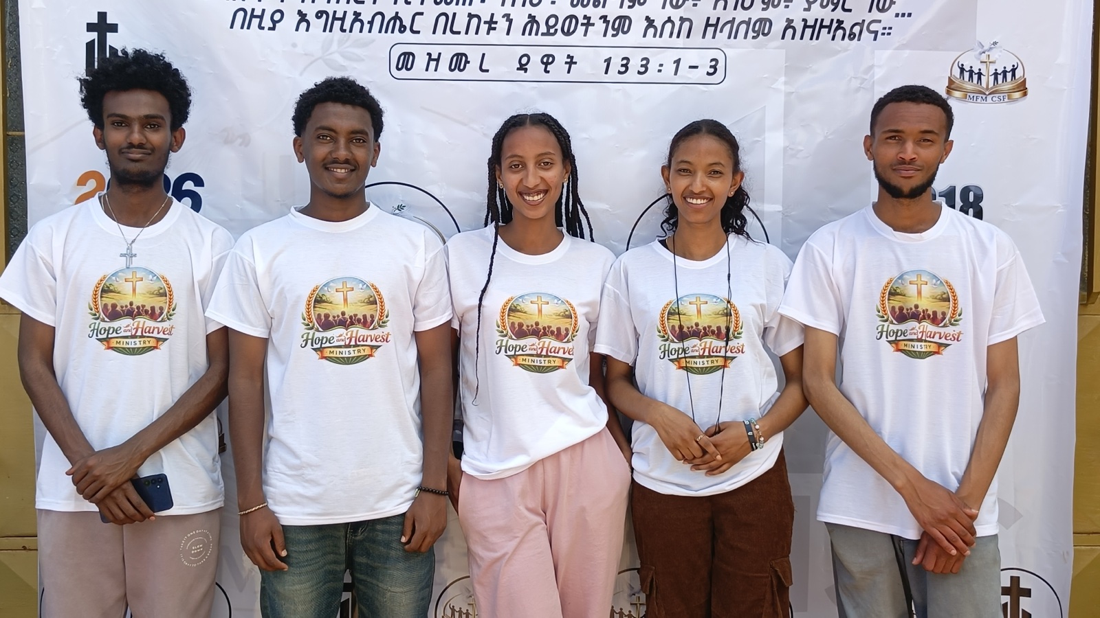 Volunteers wearing Hope and Harvest Ministry t-shirts