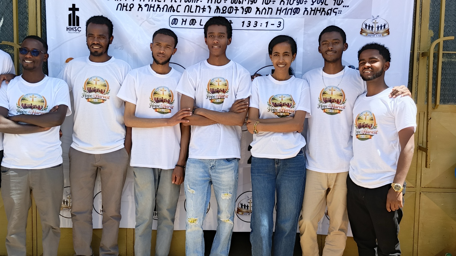 Volunteer team standing together at an outreach event